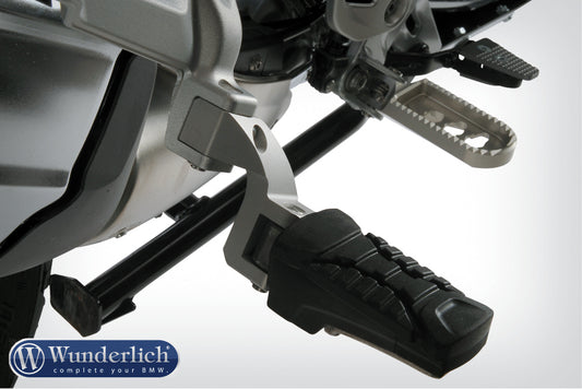 Passenger footrest relocation