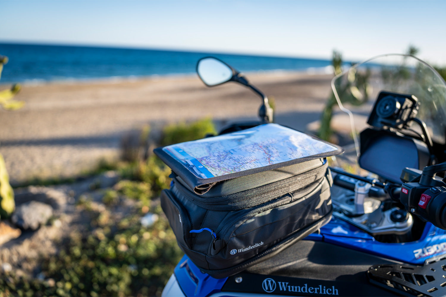 Motorcycle with a Wunderlich bag on a beach